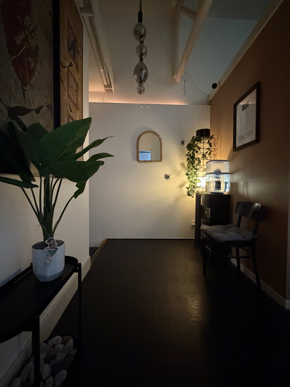 Studio reception with plants and softly lit seating